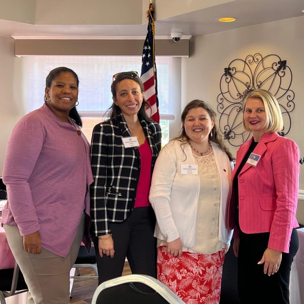 Members of WID Mid-Atlantic pose together at an annual Breast Cancer event