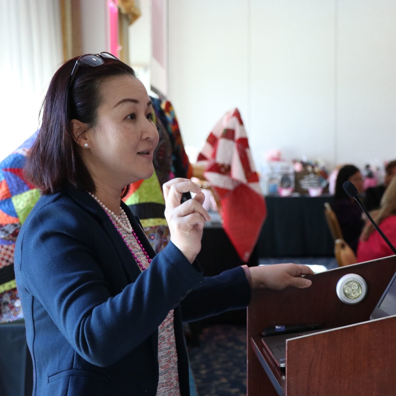 WID member speaking at an appreciation event